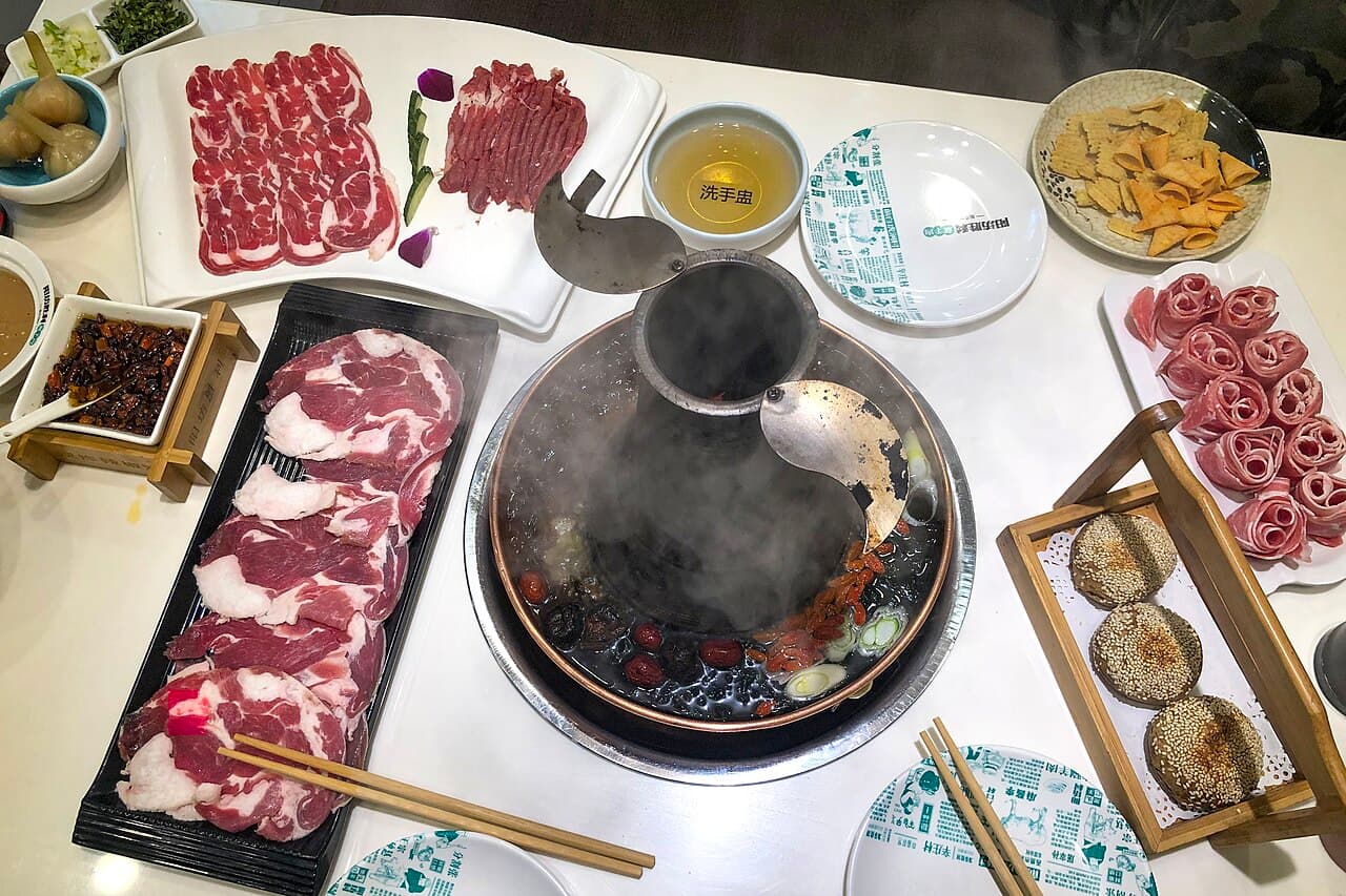 Beijing copper-pot lamb hotpot with sliced meat and sesame dipping sauce