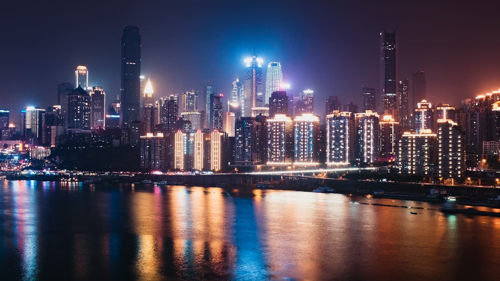 Chongqing skyline illuminated beside the river
